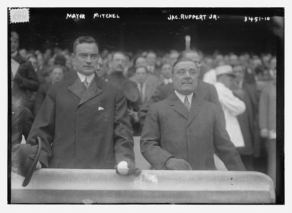 4/22/1915 | Ruppert (right) and NYC Mayor John Purroy Mitchel take in the Yankees’ home opener (Wikimedia Commons)
